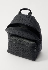 Black backpack made of textured synthetic material features dual zippers, an embossed logo pattern, and a top handle for carrying.