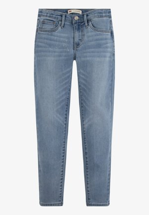 Ljust blå tajta jeans gjorda av denim. Har fem fickor, en framknäppning och subtila blekningar med tydliga nigning detaljer.