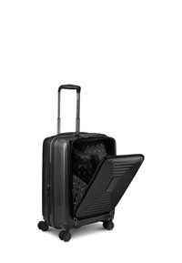 Valise rigide noire avec poignée extensible et compartiment avant ouvert, montrant les poches intérieures et quatre roulettes multidirectionnelles.