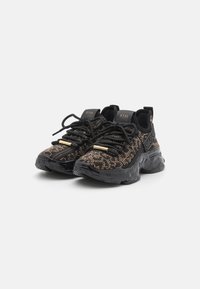 Black sneakers with a textured textile upper featuring a golden pattern, sturdy black rubber soles, and black laces with gold accents.