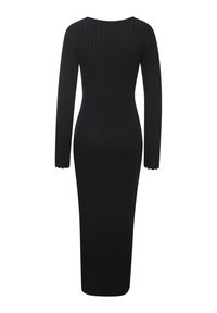 Zwarte geribbelde gebreide jurk met lange mouwen, strakke pasvorm en golvende manchetten. Gladde textuur en enkellange stijl.