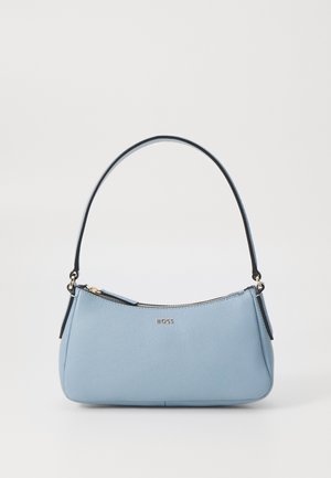 Light blue leather handbag with a curved shape, featuring a black strap, gold zipper, and embossed brand logo. Smooth texture.