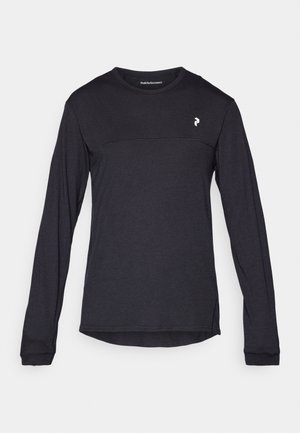 Black long-sleeve crewneck shirt with small white logo on the left chest and horizontal seam detail across the upper chest.