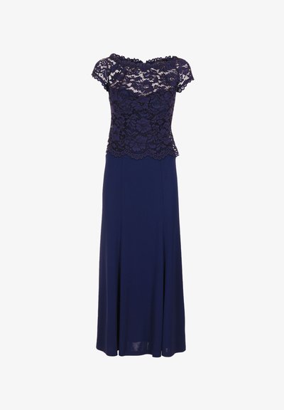 Laulu navy sininen mekko, jossa on kukkainen pitsipäällinen lyhyillä hihoilla ja virtaava, yksivärinen hame. Pitsissä on aaltoilevat reunat. Sileä kangas rakenne.