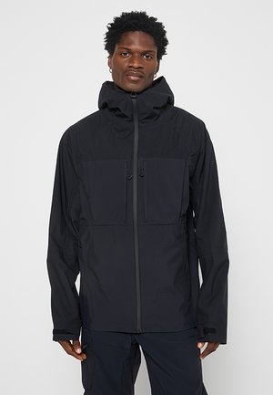 Czarna, wodoodporna kurtka z kapturem, posiadająca dwie przednie kieszenie i zamek błyskawiczny. Wykonana z teksturowanej tkaniny z regulowanymi mankietami.