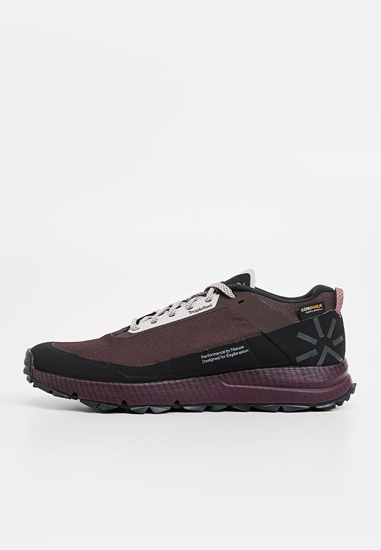 Dark purple and black hiking shoe with a mesh upper, reinforced toe, and textured sole. Features logo and branding on the side.