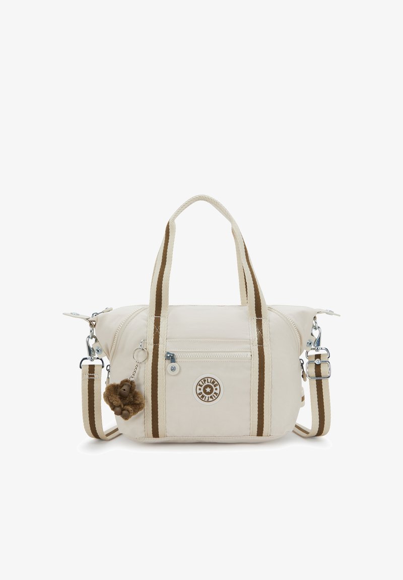 Witte stoffen tas met bruine gestreepte accenten, dubbele handvatten, afneembare schouderriem, voorvak met rits en een sleutelhanger in de vorm van een aap.