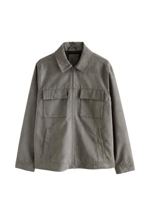 Grå jakke lavet af blødt stof, med lynlås foran, spids krave, to brystlommer og sidelommer med åbning. Ren, minimalistisk design.