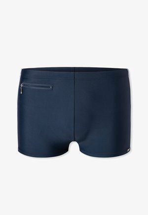 Námořnické plavky vyrobené z hladké, pružné látky, s bezpečnou zipovou kapsou na zadní straně a jednoduchým, elegantním designem.