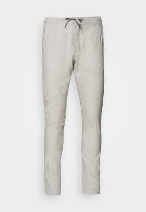 Ljusgrå linbyxor med dragsko i midjan, slim fit-design och subtil textur. Har två sidofickor och en ren fåll.