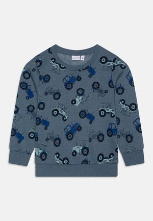 Sweatshirt pour tout-petit bleu-gris avec motifs répétés de tracteurs bleu foncé et bleu clair, avec poignets et ourlet côtelés.