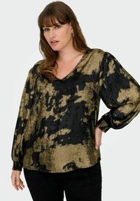 Blusa a V con maniche a sbuffo, caratterizzata da un motivo astratto nero e oro su un tessuto texturizzato. Polsini elastici e vestibilità morbida.
