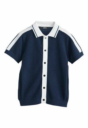 Tumesinist värvi lühikeste varrukatega kudumissärk valge nööpidega, valge krae ning valgete triipudega õlgadel ja varrukaulidel.