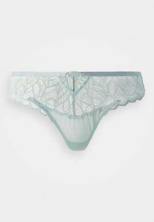 Mint green lace thong featuring floral patterns, scalloped edges, and a silver-tone hardware accent at the center. Soft mesh back.