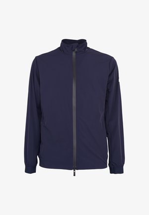 Marineblauwe lange mouwen jas met hoge kraag en zwarte rits aan de voorkant, elastische manchetten en lichtgewicht stof.