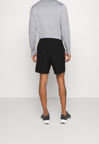 Nike Performance Urheilushortsit - black