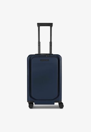 Navy hard-shell suitcase with a rectangular design, dual black telescoping handle, four wheels, and a visible zipper closure at the top.