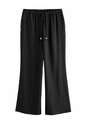 Black wide-leg pants made of textured fabric. Features an elastic waistband with drawstring and metal toggles.