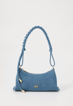 Denim handbag in light blue with a braided handle, gold accents, and a zip closure. Features a sleek, curved design and a textured finish.