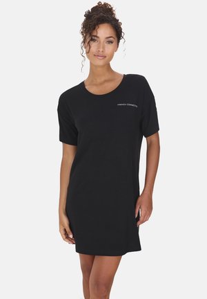 Black T-shirt dress in soft cotton with a relaxed fit, short sleeves, round neckline, and subtle logo detail on the chest.