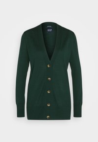 Cárdigan verde con cuello en V, mangas largas y seis botones de tono dorado en la parte delantera. Textura suave y diseño entallado.