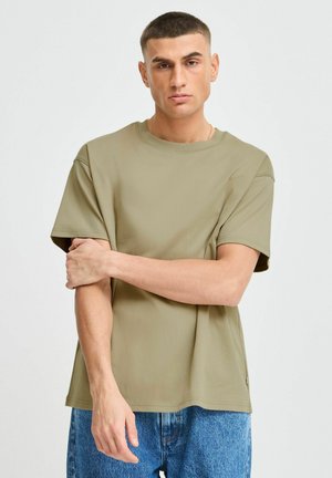 Olive green short-sleeve T-shirt with a round neck, made of smooth fabric, featuring a relaxed fit and visible stitching details.