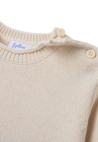 Cremfarbener Strickpullover mit geripptem Halsausschnitt und Schultern. Verfügt über zwei cremefarbene Knöpfe und ein in den Stoff eingenähtes Etikett. Mit strukturierter Oberfläche.