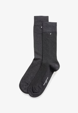 Chaussettes en coton gris foncé avec un motif chevron, des bords côtelés et des bouts renforcés. Texture lisse et longueur moyenne.