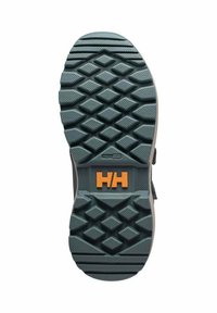 Gummisål med et struktureret mønster, i en mørkegrøn farve med orange "H"-logo. Designet til greb med et solidt, holdbart udseende.