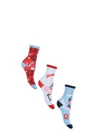 Drei Paare Kindersocken: rot mit Marienkäfer- und Ankerprints, blau gestreift mit Schweinillustration und hellblau mit marineblauen Akzenten.
