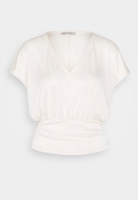 Bílý top s krátkým rukávem a výstřihem do V s nařaseným pasem. Vyrobeno z hladké, lehké tkaniny s volným designem.