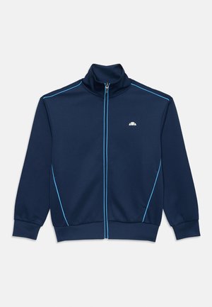 Veste de survêtement bleu marine avec un col haut, une fermeture éclair sur le devant et un passepoil bleu clair contrastant le long des épaules et des côtés.