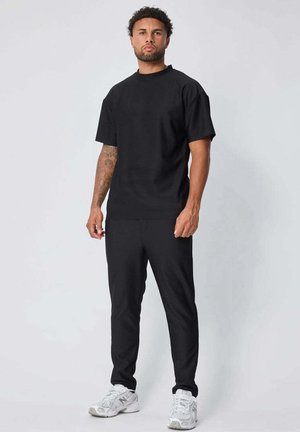 SET - Pantalon de survêtement - noir