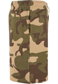 Camouflage shorts made of cotton, featuring an elastic waistband, side pocket, and a color palette of green, brown, and beige.