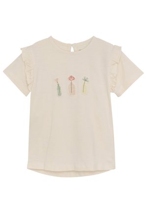Kremfarget T-skjorte med volangermansjett og en brodert design av tre vaser som inneholder blomster i rosa og grønne nyanser.