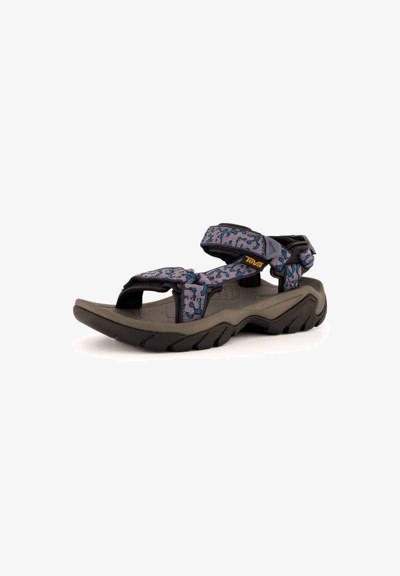 Sandalo Teva con suola in gomma grigia scura, cinturini a motivo multicolore, chiusure regolabili in velcro e design del plantare sagomato.