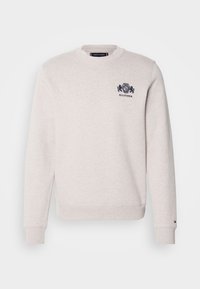 Light gray sweatshirt made of cotton blend. Features a crew neck, long sleeves, and a small navy logo on the chest. Ribbed cuffs and hem.