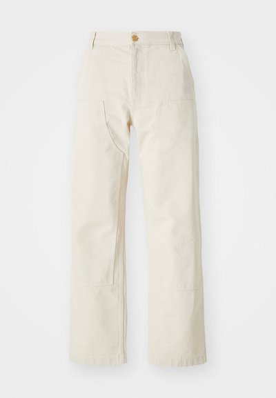 Beige wide-leg pants made of cotton, featuring a button closure, two side pockets, and a straight cut, with a smooth texture.