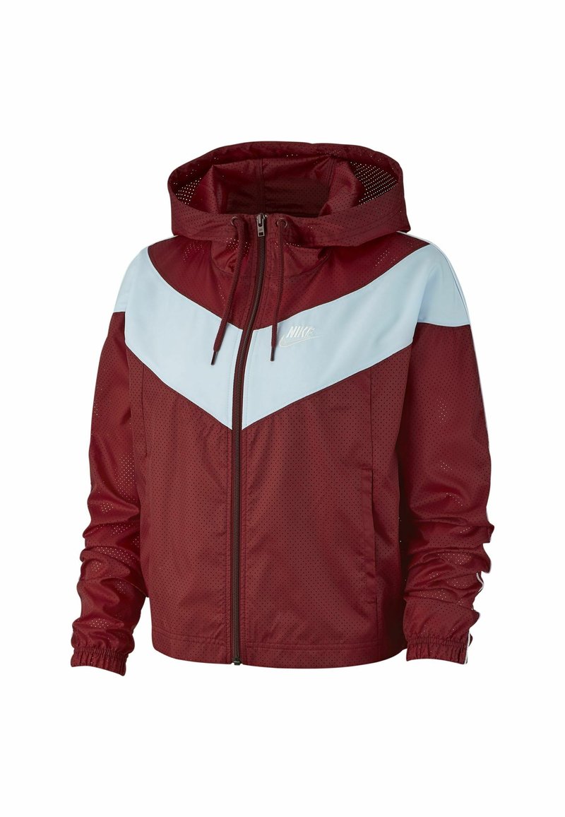 Červená a světle modrá větrovka s kapucí, vyrobená z síťoviny, s zipovým zapínáním a designem ve tvaru chevronu. Logo Nike na hrudi.