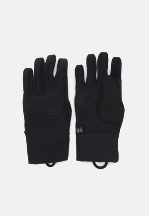 Mănuși negre dintr-un material elastic și neted; zone texturate pentru prindere pe degete și palmă; curea ajustabilă cu clips pentru o fixare sigură.