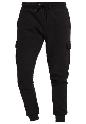 Pantaloni jogger neri in cotone con vestibilità affusolata, vita con coulisse e tasche cargo laterali. Tessuto morbido e polsini elasticizzati alle caviglie.