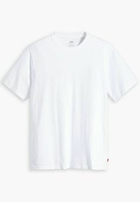 Biała bawełniana koszulka z okrągłym dekoltem, krótkimi rękawami i prostym dołem. Mała czerwona metka marki na dolnej stronie. Gładka tekstura.