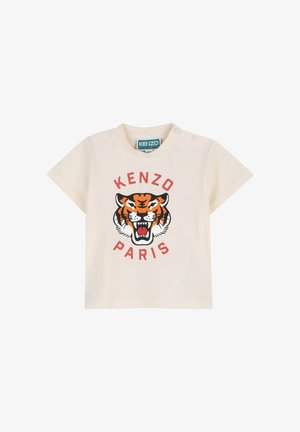 Chemise à manches courtes pour tout-petit de couleur crème avec un graphique de tigre rugissant et le texte "KENZO PARIS" en rouge, dotée de boutons-pression sur l'épaule.