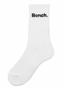 White ribbed socks with a black embroidered "Bench." logo on the upper part. Soft texture with a standard crew length design.