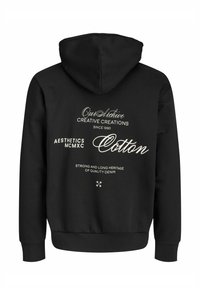 Mustast puuvillast kapuutsiga dressipluus, mille tagaküljel on suur valge graafiline tekst "Creative Creations" ja muud brändielemendid.