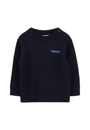 Navy blue knit sweater with textured body, ribbed collar and cuffs, and two button accents on the shoulder. Features Timberland logo in light blue.