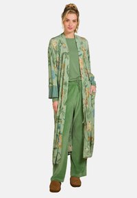 Green floral-patterned long kimono with a tie waist, striped cuffs, and matching green pants. Fabric appears soft and textured.