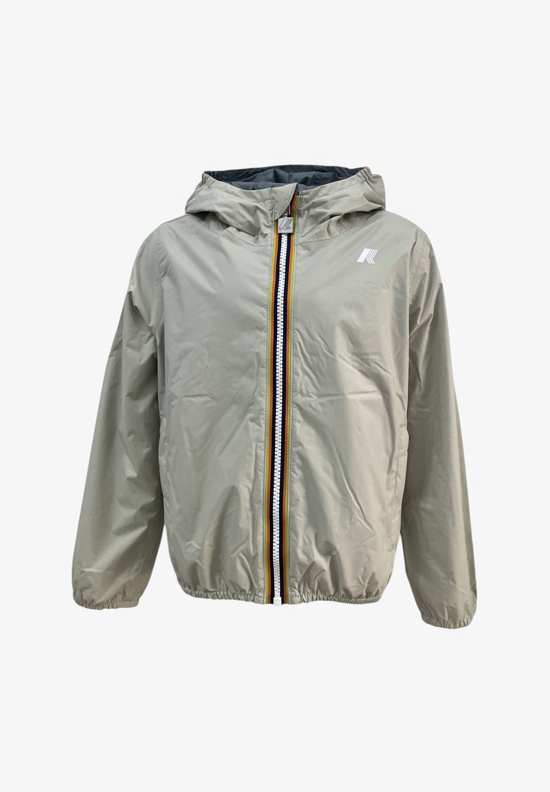 Giacca cappuccio beige chiaro in un materiale liscio e leggero. Presenta una zip frontale completa con strisce colorate e polsini elasticizzati.