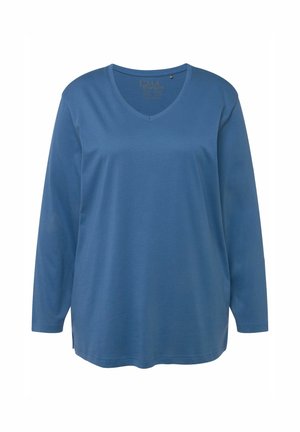 Camisa de manga larga con escote en V en un tejido azul sólido. Mezcla de algodón suave con un corte relajado y sutiles aberturas en los lados del dobladillo.