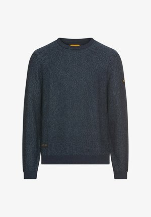 Ciemnoniebieski sweter z dzianiny o teksturowanym wzorze, z okrągłym dekoltem i ściągaczami. Posiada małą naszywkę z logo na dolnym lewym rogu.